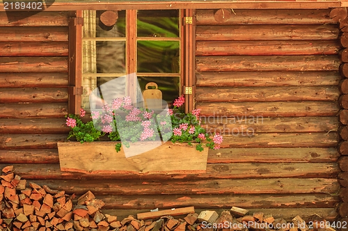 Image of Small wooden cottage with window