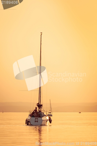 Image of Sailing boats with a beautiful sunset