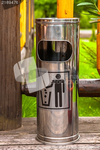 Image of Steel garbage bin outdoors