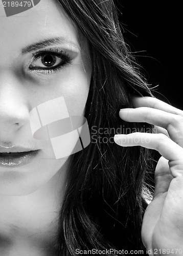 Image of Young woman against dark background