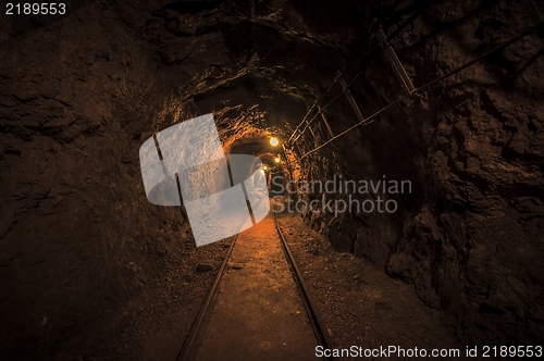 Image of Underground mine passage with rails