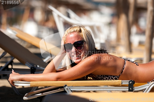 Image of Young blond woman at the beach