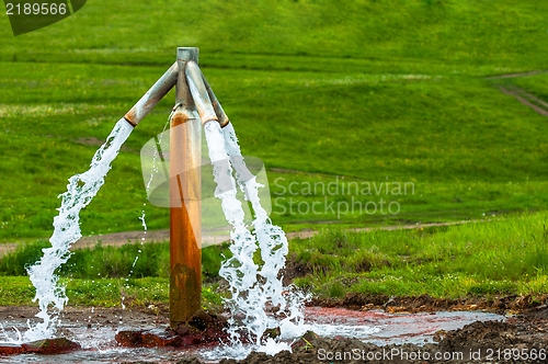 Image of Water flowing from outdoor tap