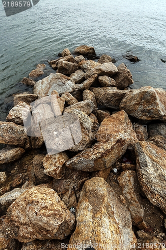 Image of Shore of an ocean with big rocks