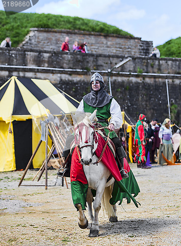 Image of Knight Riding Horse