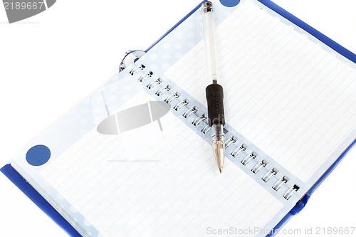 Image of Close-up of empty notes with black pen