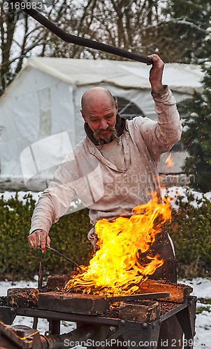 Image of The Blacksmith Working