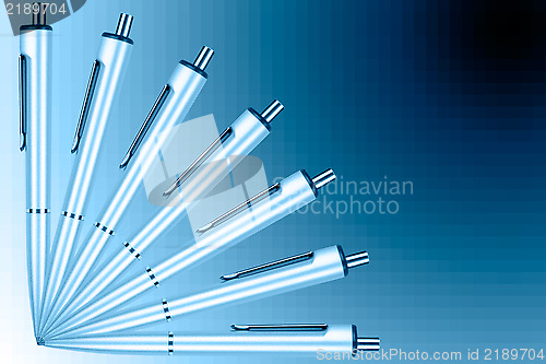 Image of Fan of pens on a blue graduated background
