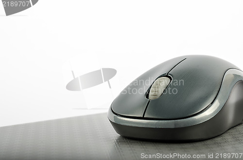 Image of Wireless computer mouse on a metallic background