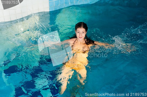 Image of Attractive girl in swimming pool