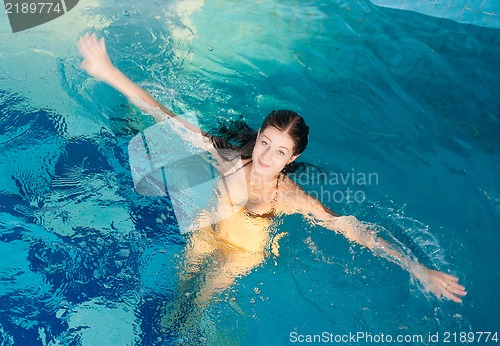 Image of Attractive girl in swimming pool