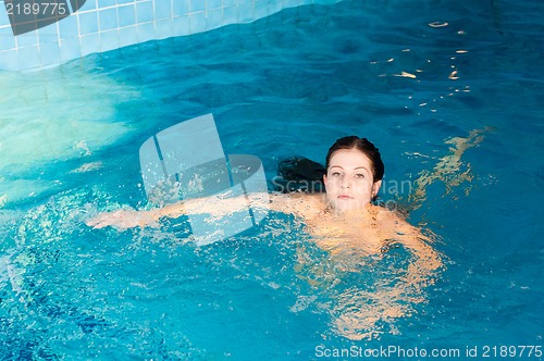 Image of Attractive girl in swimming pool