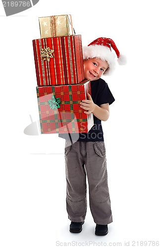 Image of Smiling boy holding presents