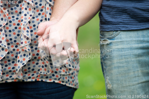 Image of Couple Holds Hands
