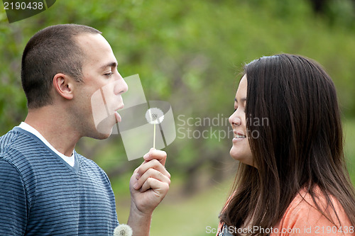 Image of Boyfriend Blows a Dandelion