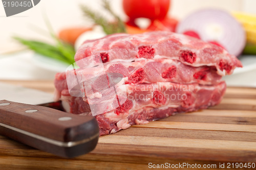 Image of chopping fresh pork ribs and vegetables