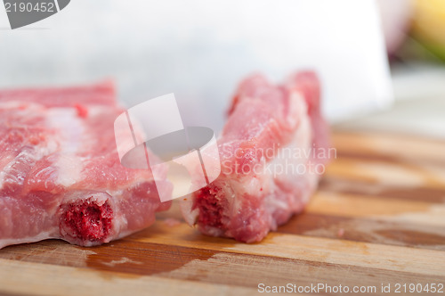 Image of chopping fresh pork ribs 