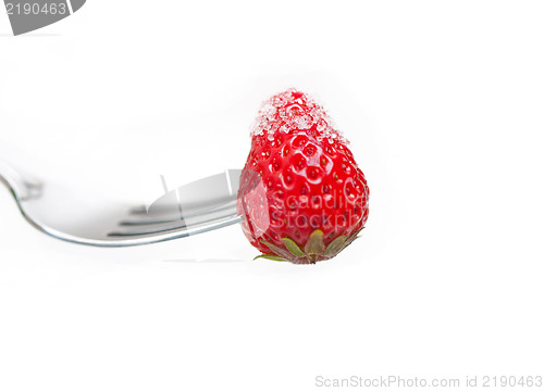 Image of srawberry on a fork isolated