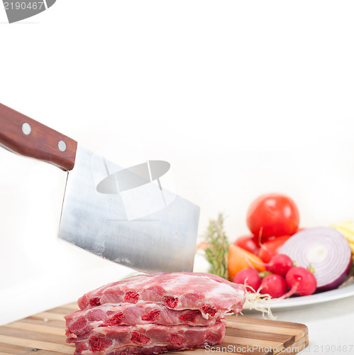 Image of chopping fresh pork ribs and vegetables