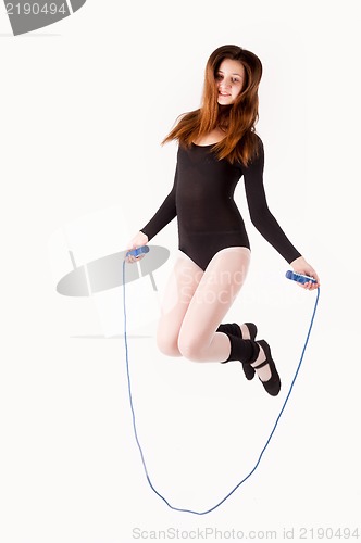 Image of fitness woman with jumping rope