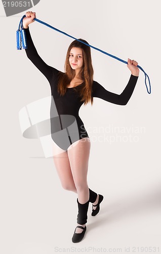 Image of fitness woman with jumping rope