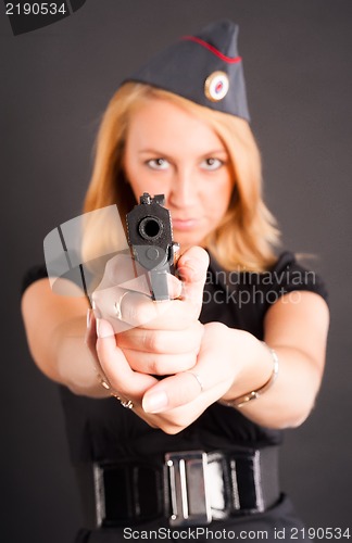 Image of Pretty woman with a gun