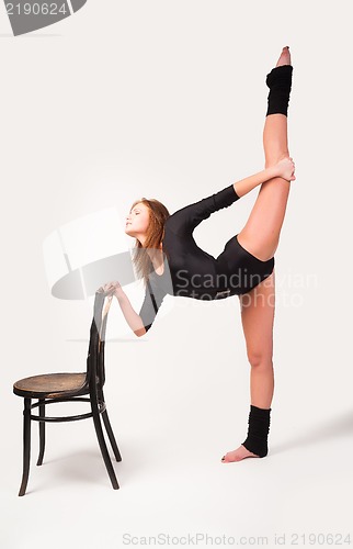 Image of fitness woman making balance exercise