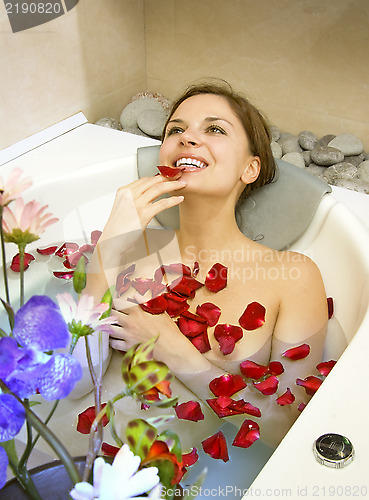 Image of woman in rose-petals