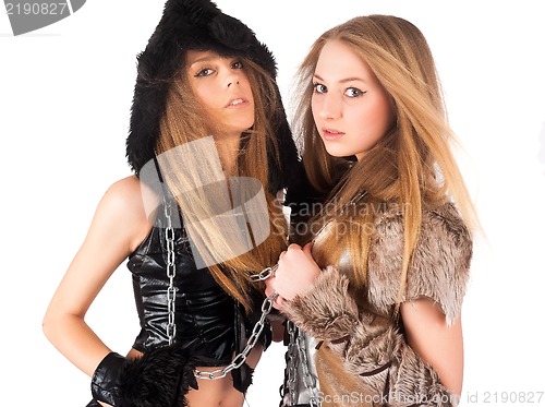 Image of Two girl in barbarian and cat costumes