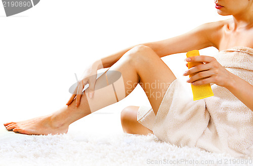 Image of woman applying cream