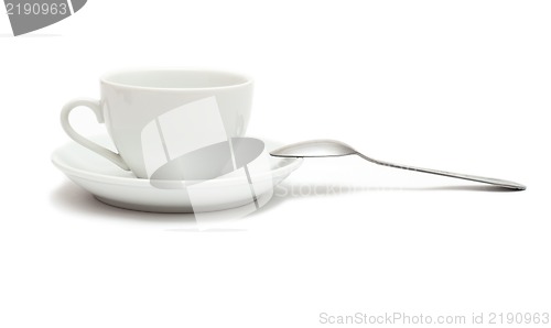 Image of white cup with spoon and saucer