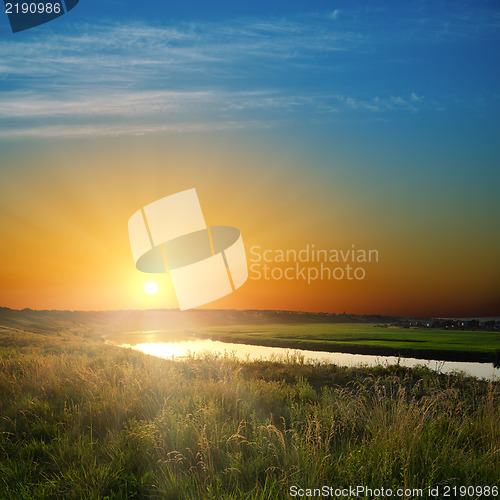 Image of golden sunset over river