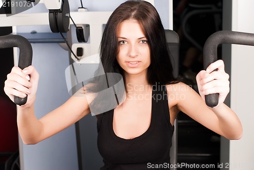 Image of Young woman in sport club