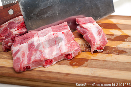 Image of chopping fresh pork ribs 