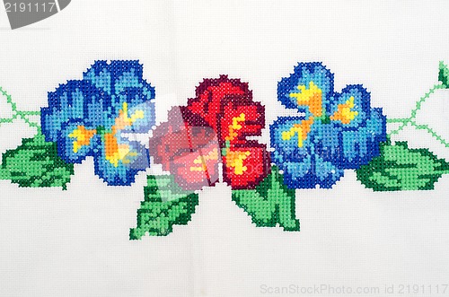 Image of embroidered good by cross-stitch pattern