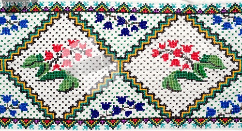 Image of embroidered good by cross-stitch pattern