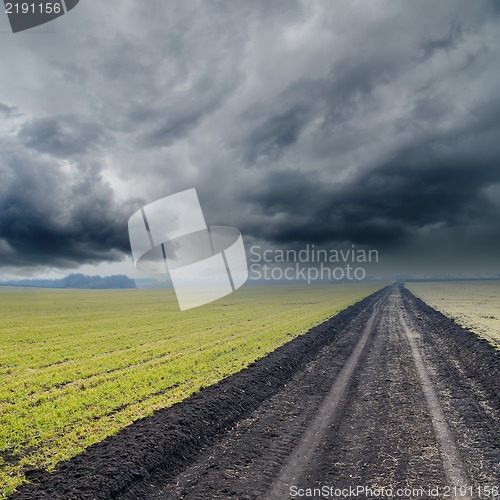 Image of dirty road under dramatic sky