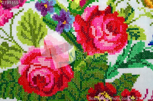 Image of embroidered good by cross-stitch pattern