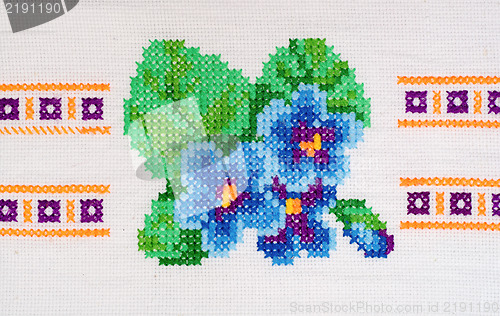 Image of embroidered good by cross-stitch pattern