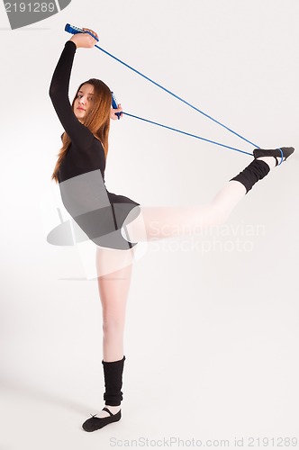 Image of fitness woman making balance exercise