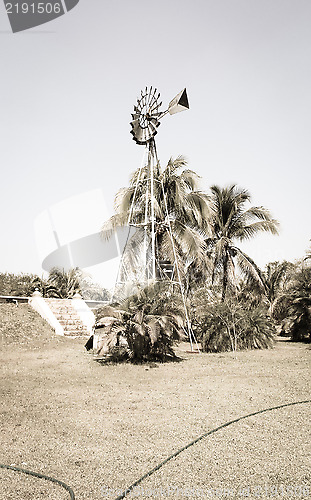 Image of Vintage Windmill on the field 