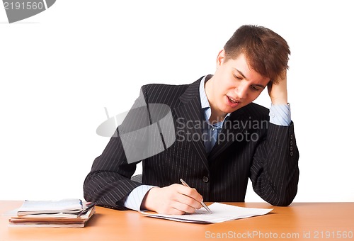 Image of Cute man writing document