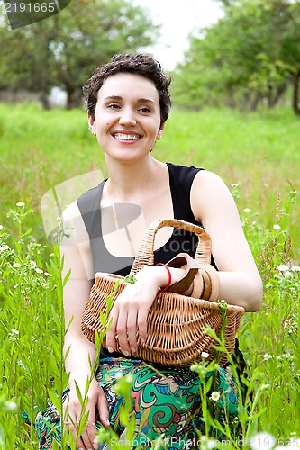 Image of woman with basket in the garden 