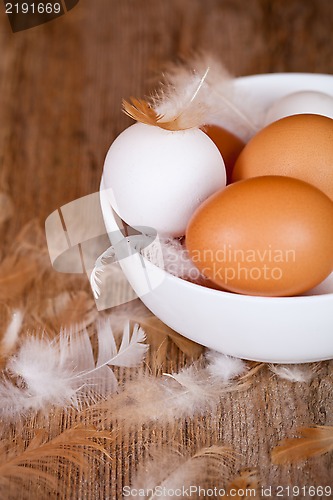Image of brown and white eggs in a bowl