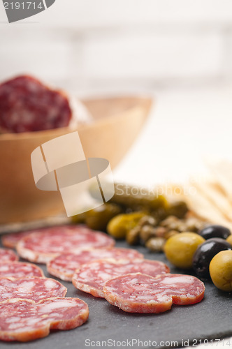 Image of cold cut platter with pita bread and pickles