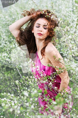 Image of Brunette playing with her hair