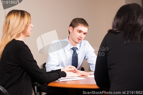 Image of Young and successful businessman in the office