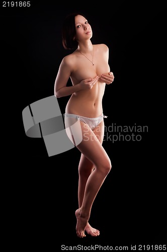 Image of topless woman body covering her breasts