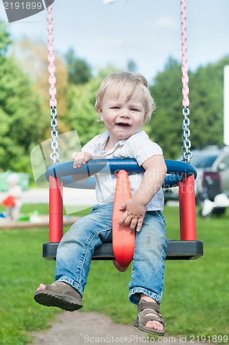 Image of Swinging little boy