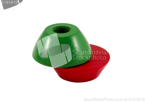 Image of green red color wooden toy bricks hole center 